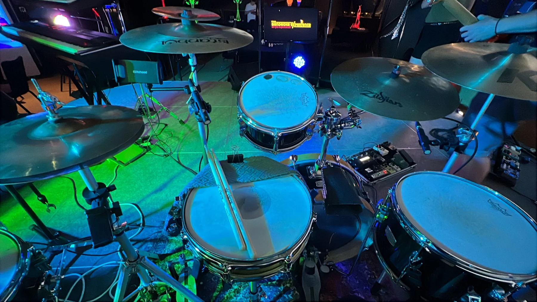 Acoustic drum shells, cymbals and hardware seen from the playing position