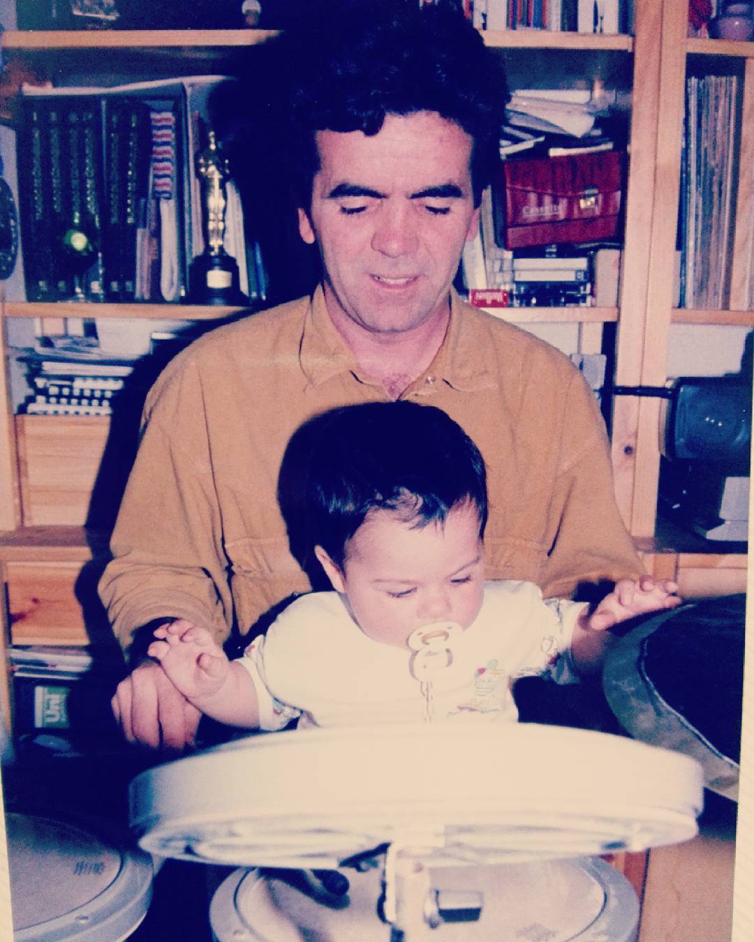 A childhood photo of Oscar at the drums with his Dad